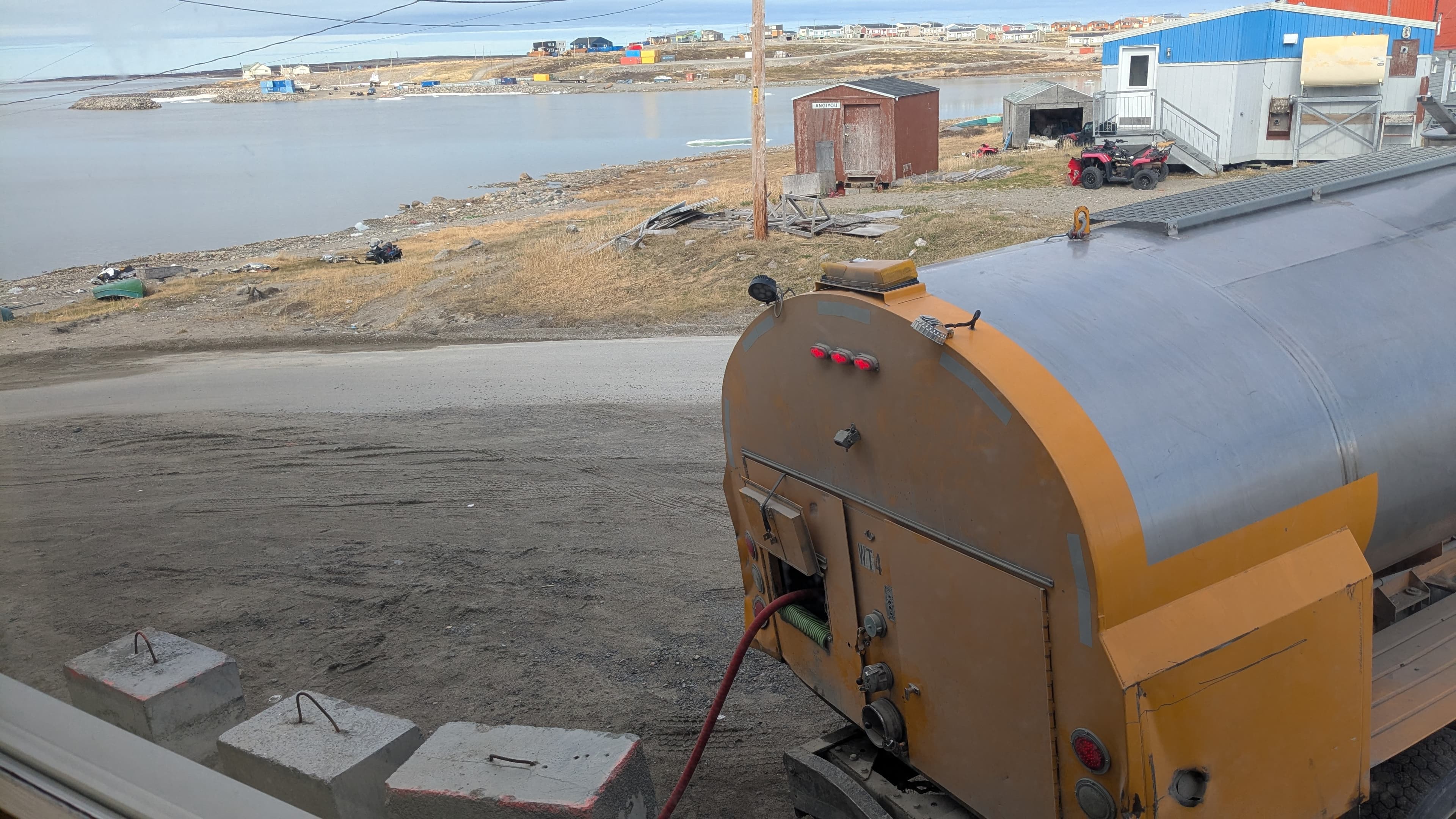 truck filling water tank in Puvurnituq