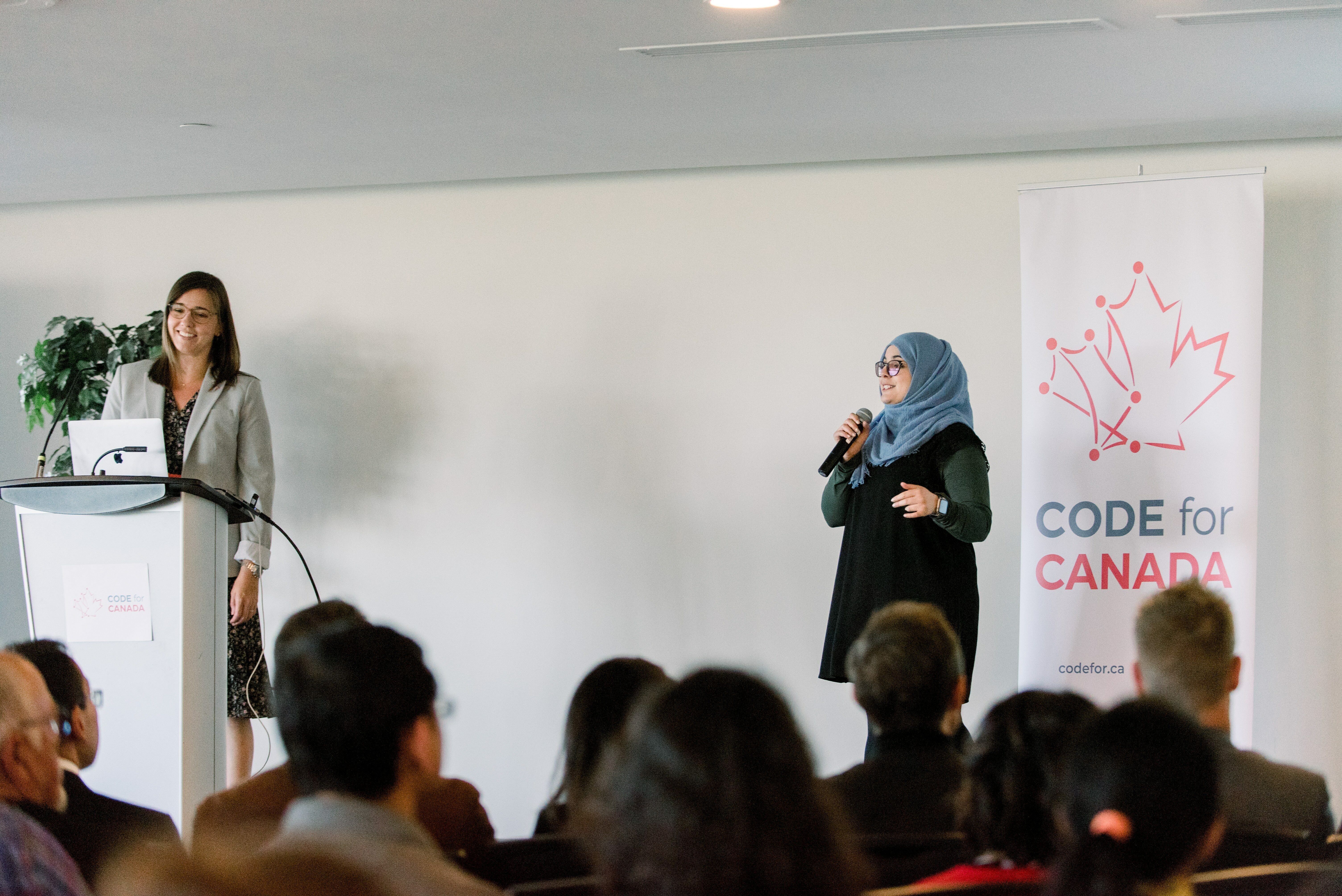 Jeannie Stewart Smith (left) from Transport Canada and Code for Canada fellow Fatima Khalid (right) present at the 2018 Code for Canada Showcase.