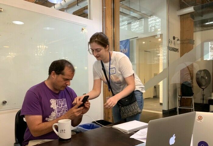 Lisa Cormier from Transport Canada setting up one of the participants to test out the Vehicle Recalls Canada Alexa Skill.