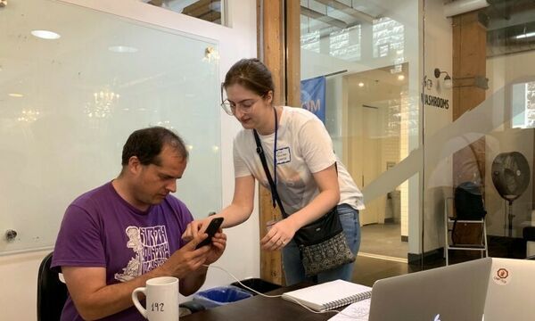 Lisa Cormier from Transport Canada setting up one of the participants to test out the Vehicle Recalls Canada Alexa Skill.