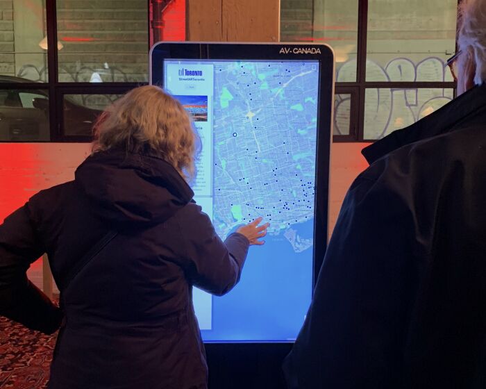 Users try out a preview of the StreetARToronto web map at the public launch event in November 2018.