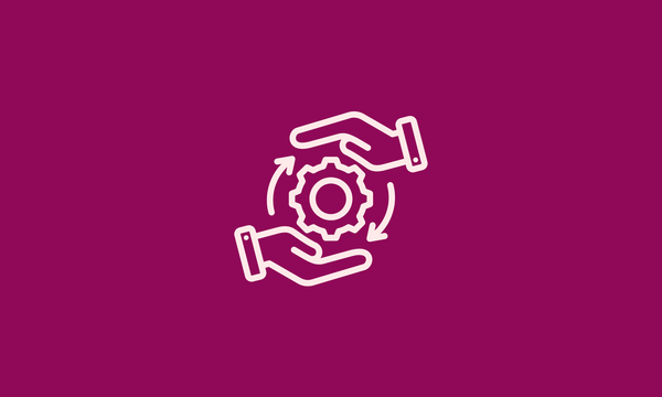 Two hands are holding a gear wheel in front of a white background