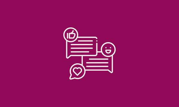 Two speech bubbles with a smiley face and a heart