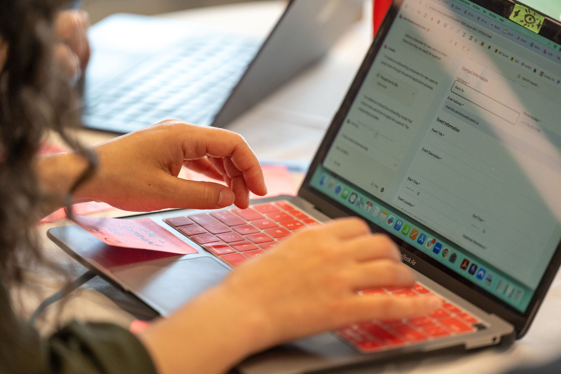 Person's hands using a computer
