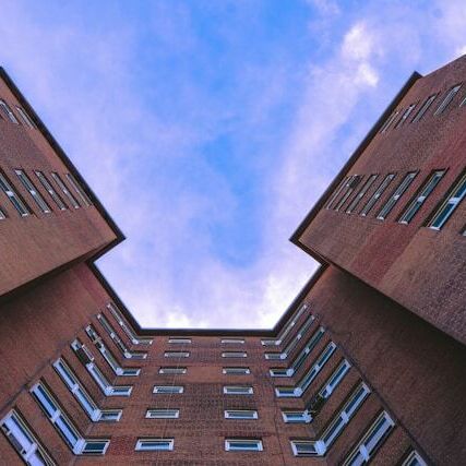 An apartment complex shot from below